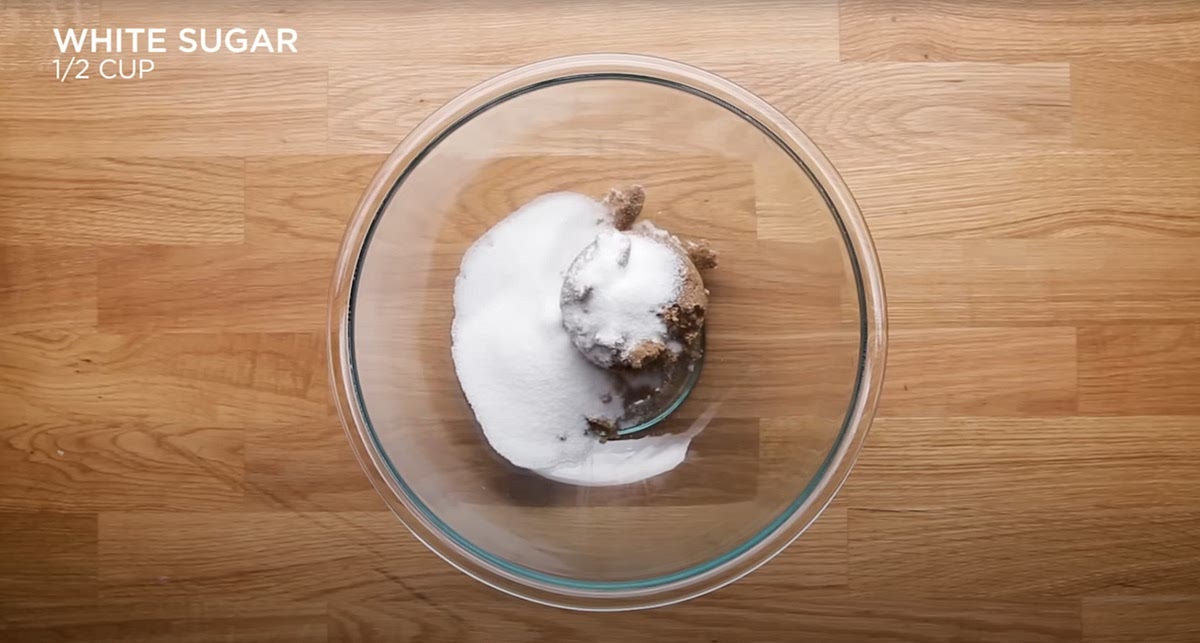 In a mixing bowl, combine the white sugar, brown sugar, vanilla extract, espresso powder, and browned butter. Mix well. Add the egg and egg yolk, stirring until fully incorporated. Finally, add the flour mixture and mix until combined.