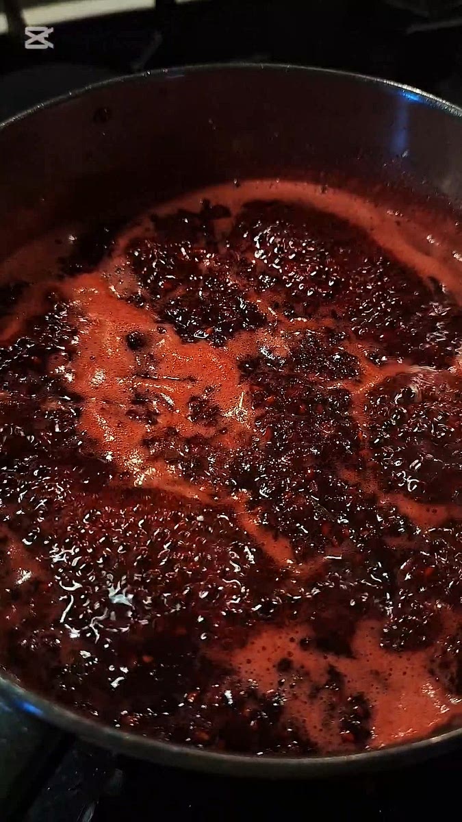 Stir the jam regularly until it reduces and thickens.