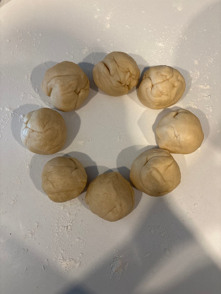 Roll the sections into balls and roll or press into a flat, round-ish shape
