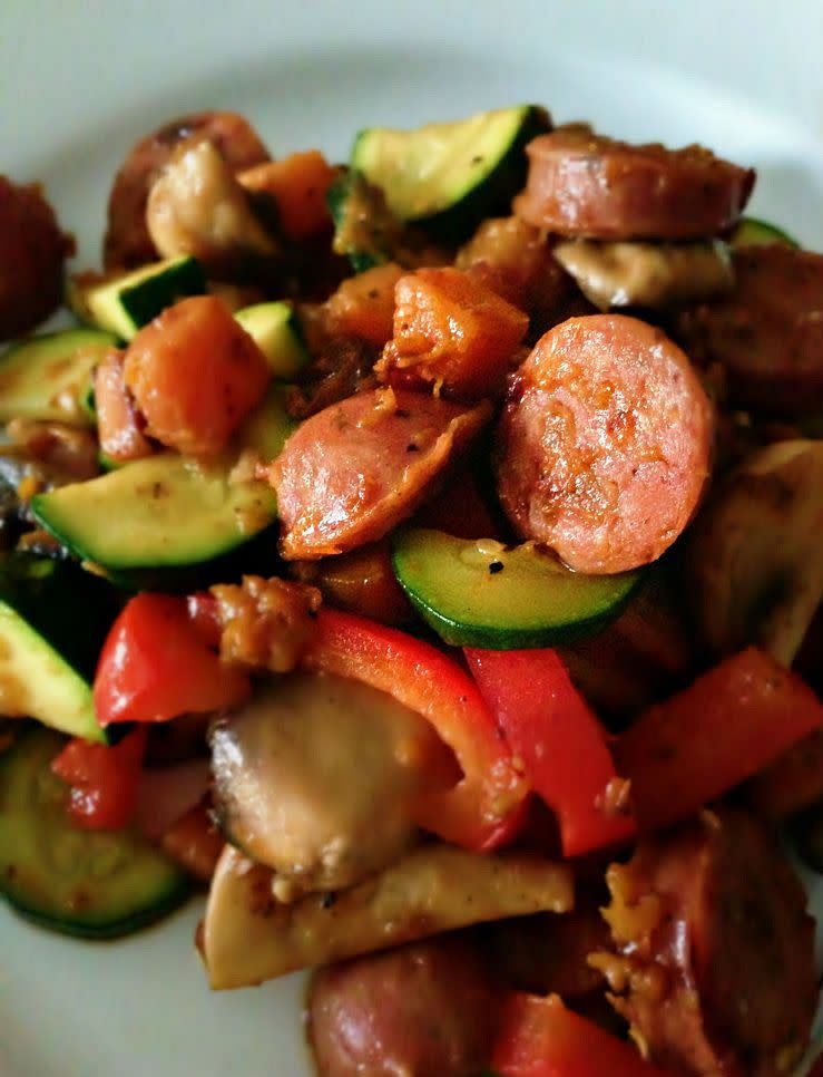 Using a heat proof wooden utensil, cook meats.