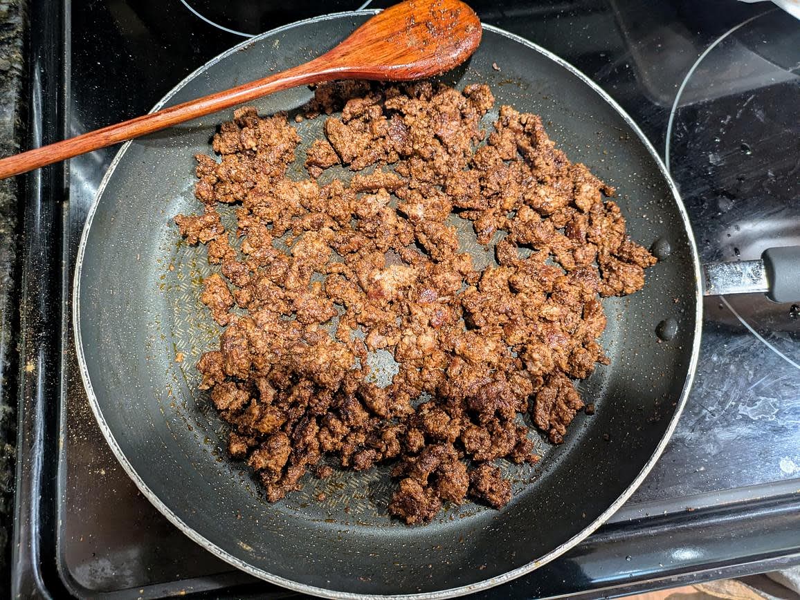 When the potatoes have about 10-15 minutes left, start on the beef. Preheat a pan over medium heat, and brown the beef. Season with chili powder, cumin, salt, and cinnamon. Set aside