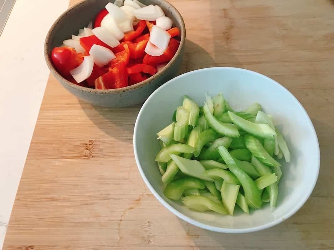 Prepare the bell pepper, celery, and onion in one bowl.
