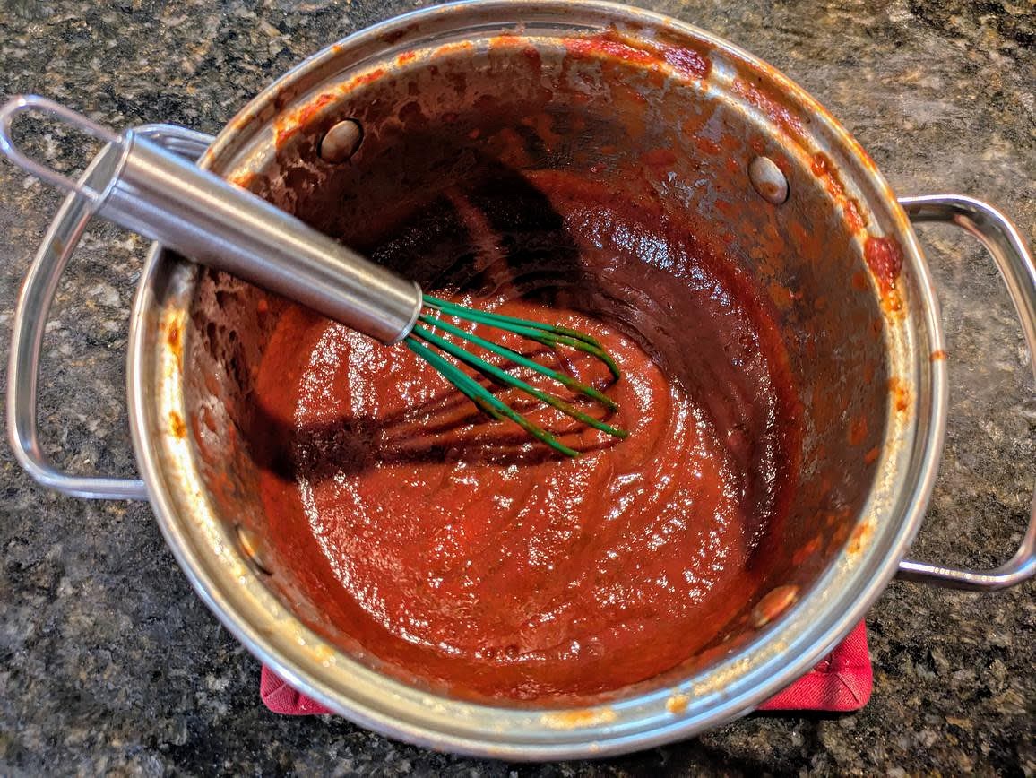 Whisk together all the ingredients in a medium saucepot. Cover, and cook over low heat for about 20 minutes, or until bubbling and thickened