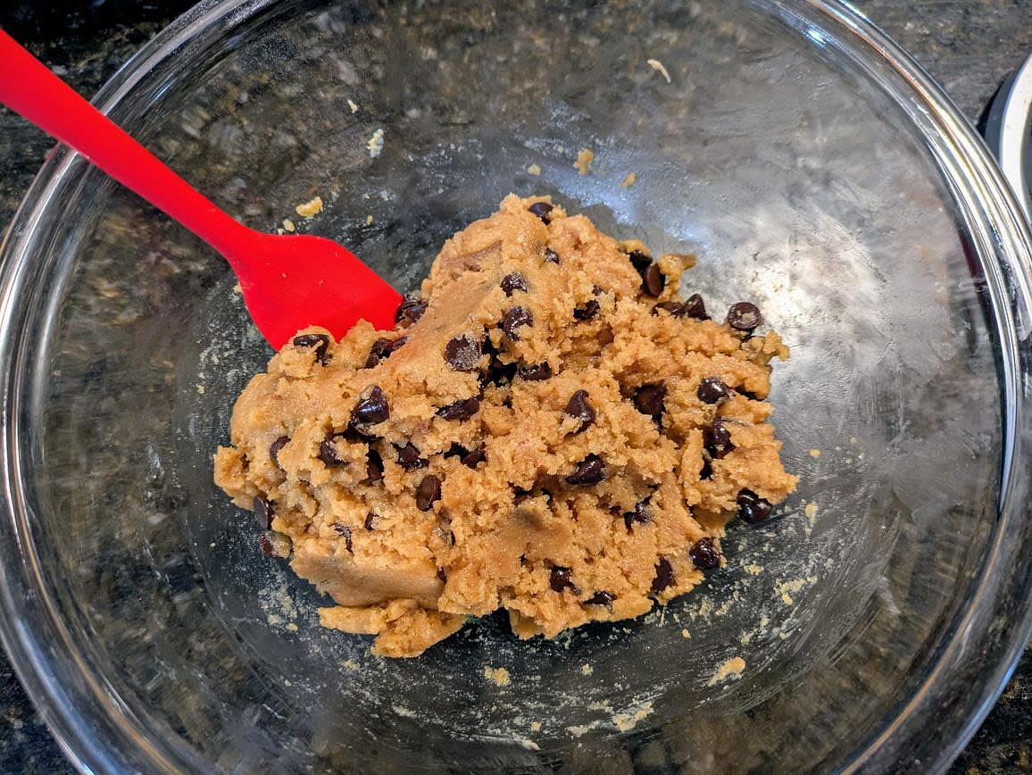 Mix together the nut butter, sweetener, egg, vanilla, salt, and baking soda until just combined. Fold in the chocolate chips