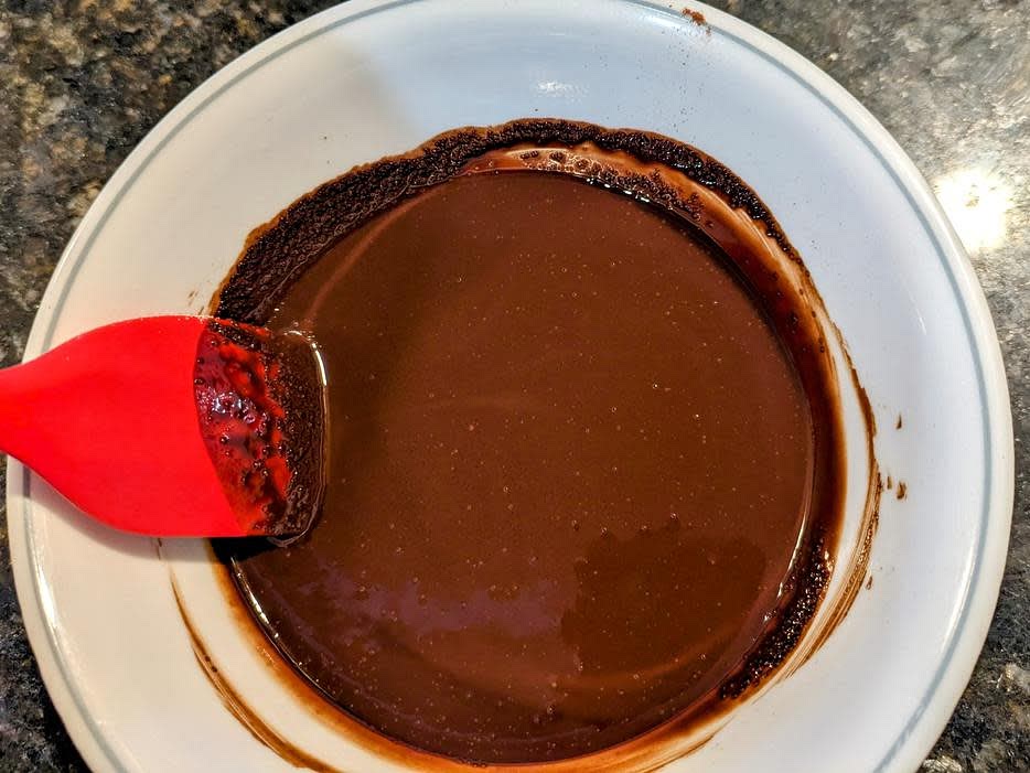 In a small bowl, microwave coconut oil for about 1 minute, until melted. Stir in cocoa powder and sweetener with a silicone spatula until smooth