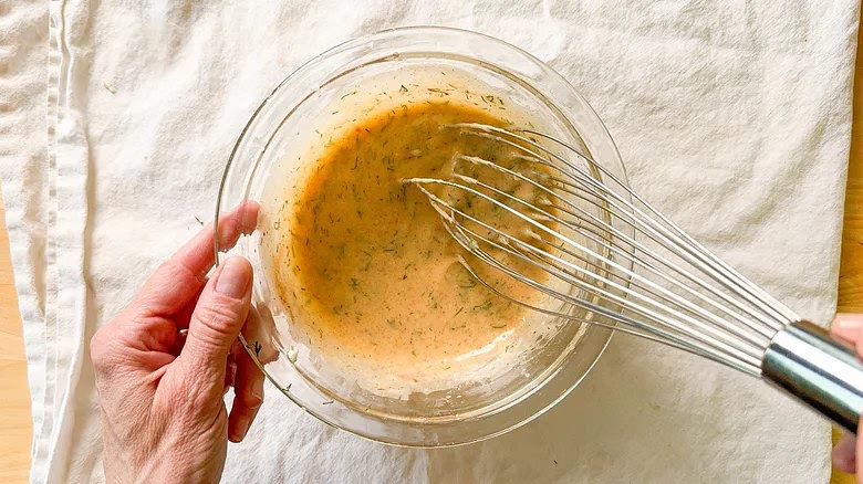 Add the chopped dill, horseradish, lemon juice, smoked paprika, sea salt, and white pepper, whisking to combine.