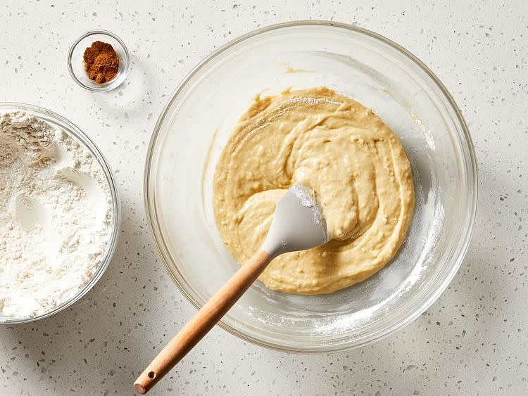 Mix in 2 cups flour, milk, sugar, melted butter, egg, and salt until combined.