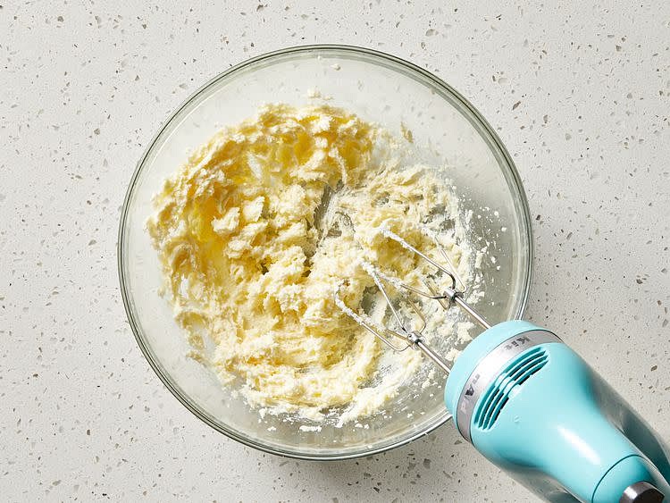 Meanwhile, make the topping: Beat sugar and butter in a medium bowl with an electric mixer until light and fluffy.