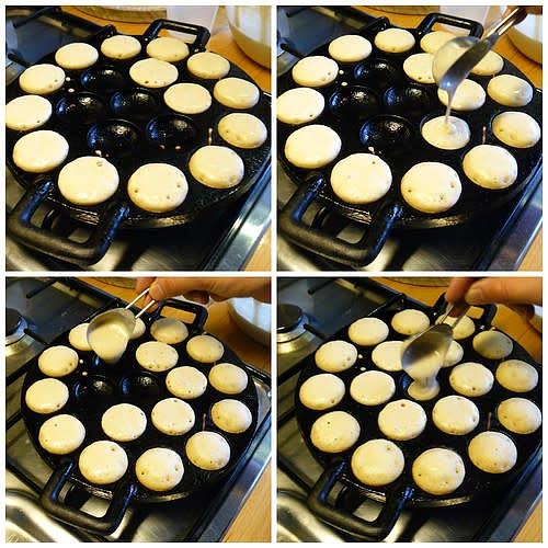 For pofferje pan or waffle iron or regular pancake sized poffertjes in a skillet, make fried poffertjes:
1. In a large bowl, mix together the 2 heaping cups soy milk, 2 Tbsp sugar, 1 1/2 tsp instant yeast, and 1 Tbsp oil. Add the 1 cup flour, 1 cup buckwheat flour, and 1/2 tsp salt and mix into a smooth batter. Cover the bowl with a towel and let sit for about an hour.
2. Just before the batter has finished resting (it won’t rise very much), put your greased poffertjespan (see below) on the stove over low heat (Wikipedia says high heat, but I prefer to start with low…) until it’s very hot. If you’re cooking the poffertjes in a waffle iron, you may want to follow the instruction manual, but I just cooked mine at the middle setting and that worked fine.
3. Scoop the batter into the indentations in the pan: I use a measuring spoon and use about a tablespoon of batter per poffertje. Flip the poffertjes when the tops are dry and the bottoms are browned — this can go very quickly, so make sure you watch them. If they stick to the pan, just use the corner of your spatula and gently try to pull them out.
4. Once the poffertjes have been cooked on both sides, remove them from the pan, add a new coating of oil if necessary and repeat the process with the remaining batter.