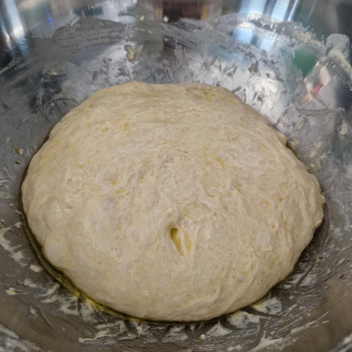 Place the dough smooth side up and even cover the dough with a sprinkle of extra virgin olive oil.