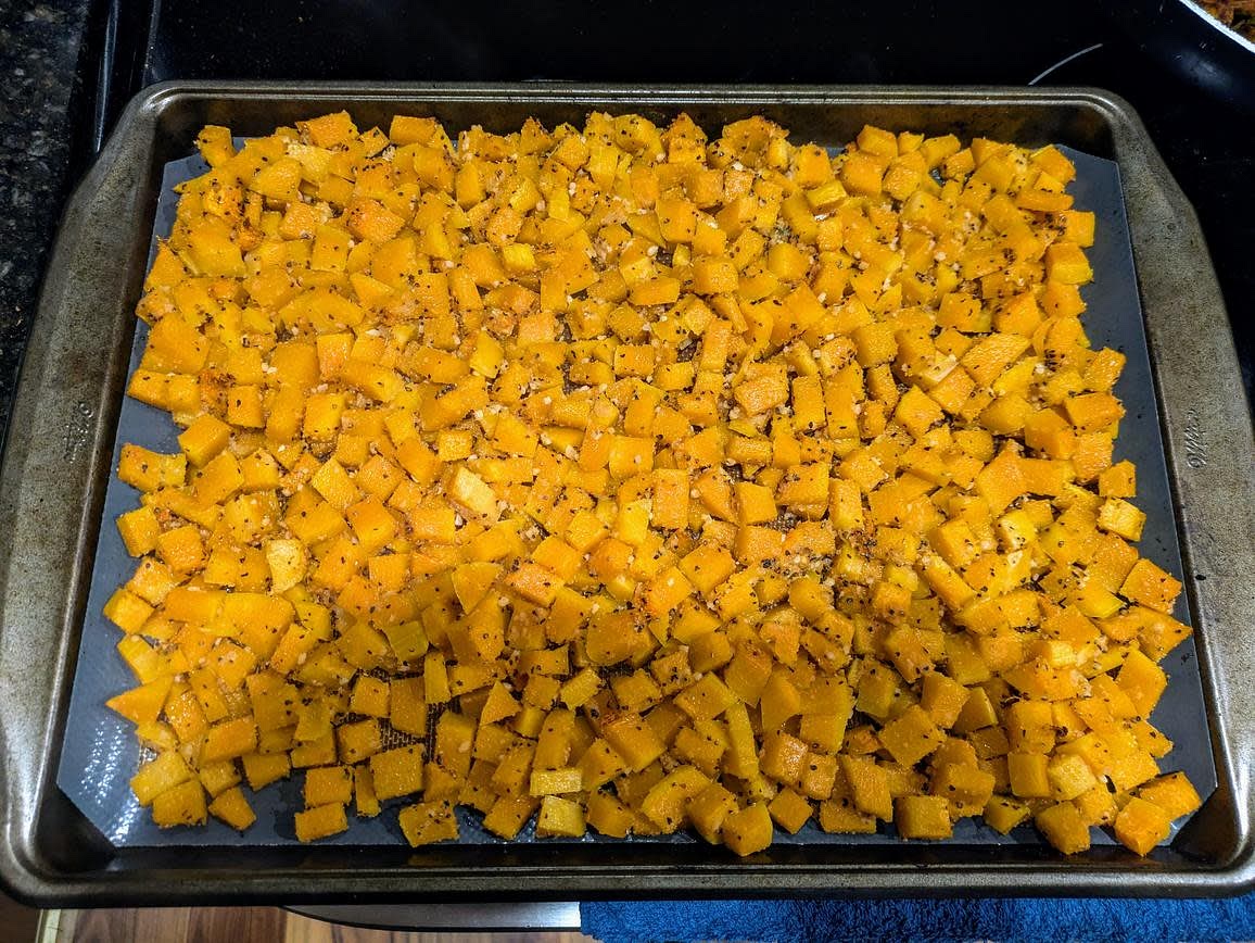 With about an hour left on the beans, you can prepare the squash. Preheat your oven to 400F, and line a large cookie sheet with parchment paper. Peel your squash, cut into a small dice, and add to the tray. Season with oil, minced garlic, garlic powder, onion powder, black pepper, and salt. Roast at 400F until fork tender and lightly browned, about 30 minutes