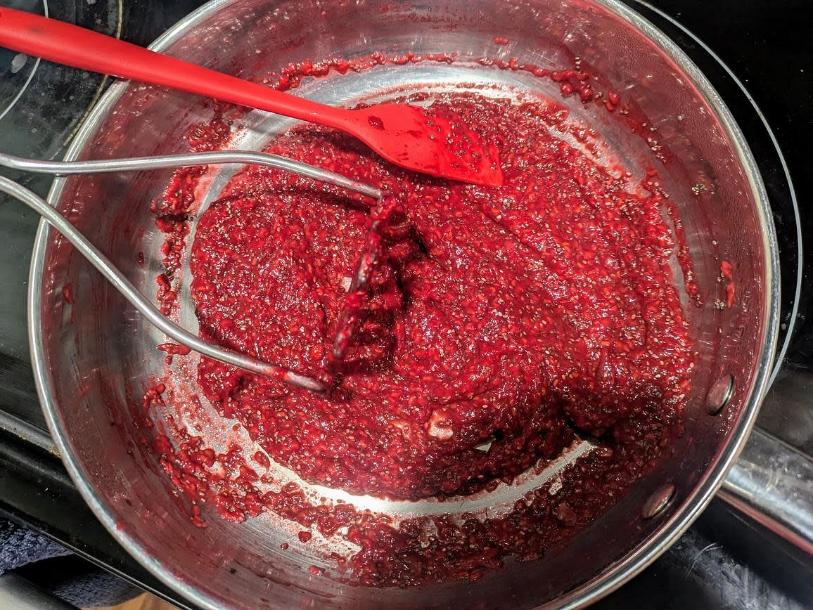 Jam: Time to prepare the jam as the layers cool. Add raspberries and dates to a medium stainless steel pan over medium low heat, and roughly mash with a potato masher. Cover and cook with occasional stirring until soft and syrupy, about 10 minutes. Blend with an immersion blender to fully break up the dates. Stir in chia seeds and lemon juice. Refrigerate to cool