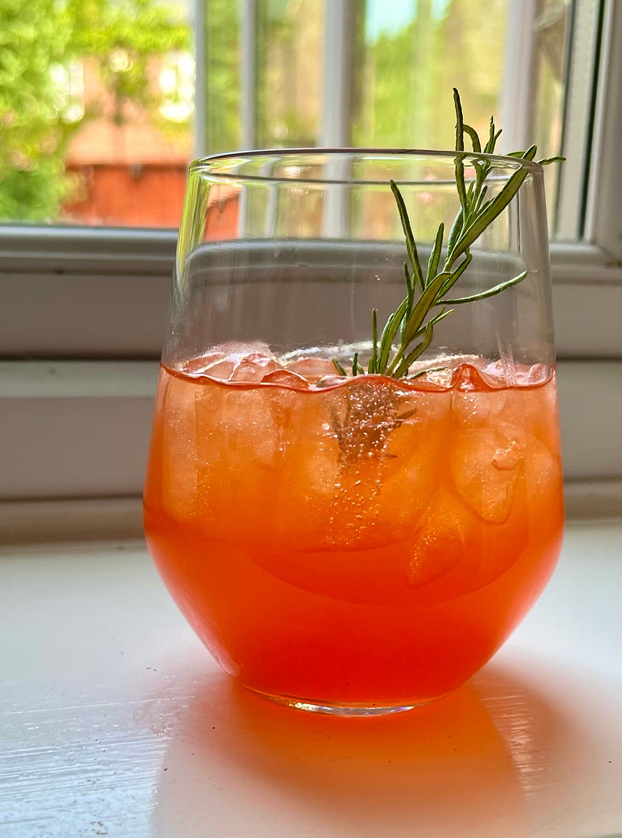 Lightly mix ingredients with a spoon from bottom to top. Garnish with a rosemary sprig and serve. Enjoy!