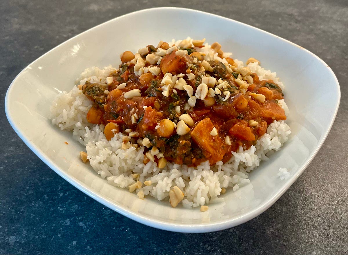 Serve over white rice, and garnish with peanuts and coriander. Enjoy!