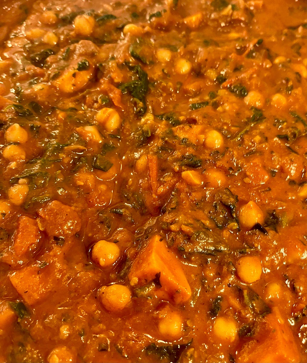 Remove from the heat, season with salt and pepper to taste, add the greens, coriander and lime juice, stirr to mix them in, and cover with a lid for 4 or 5 minutes.
