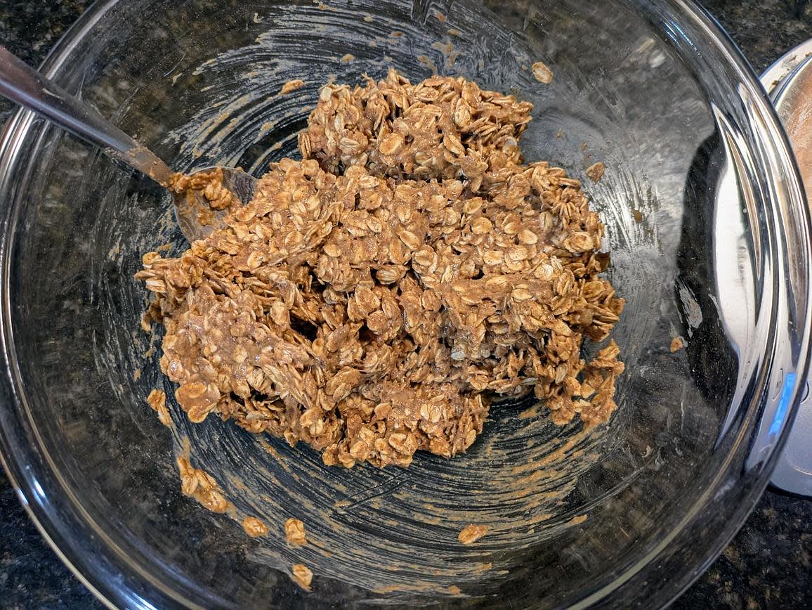 In a bowl, combine together the crust/crumble ingredients - mashed banana, cinnamon, salt, vanilla, powdered peanut butter, and oats. Mix until well combined. Add in any milk if too dry, or more oats if too wet. The mixture should be a little sticky