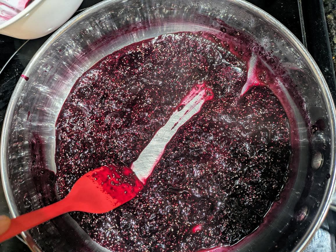 Microwave your frozen berries for about 1 minute to defrost. Add berries and sweetener to a medium stainless steel pan over medium low heat, and roughly mash with a potato masher. Cook with occasional stirring until soft and syrupy, about 10 minutes. Stir in chia seeds and lemon juice. Refrigerate to cool, at least 30 minutes so the chia seeds can thicken the jam
