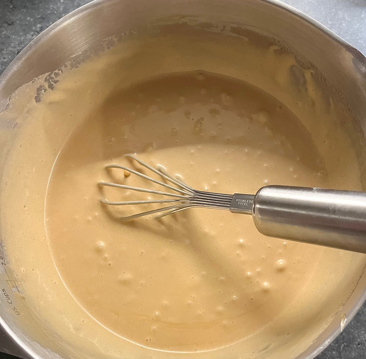 Add the softened butter to a large bowl, and beat it until creamy. Add the brown and white sugar and beat until fluffy (about 3 minutes). Then, beat in the eggs one at a time.