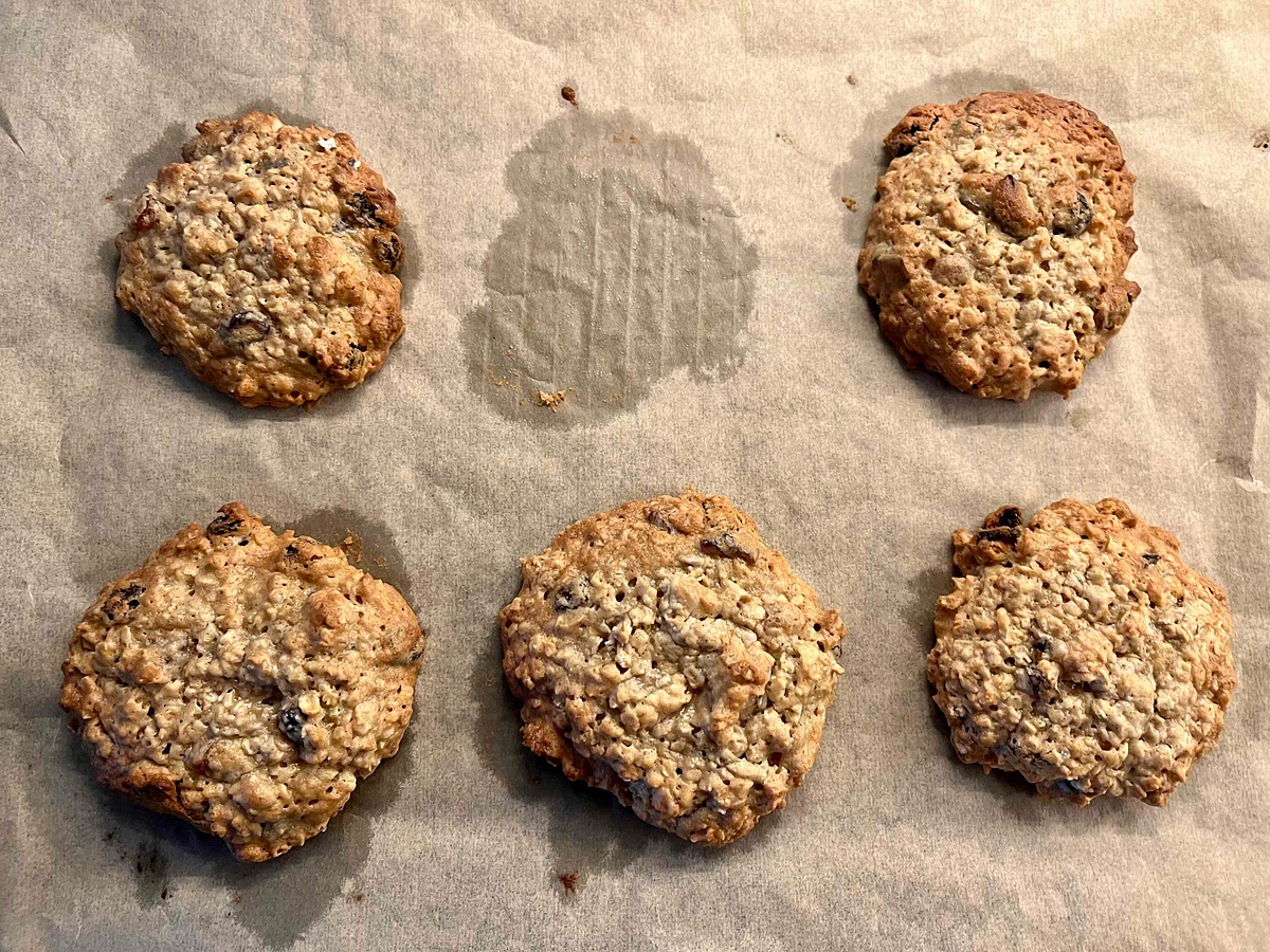 Remove the baking sheet from the oven and place the cookies on a cooling rack. I transfer them to the rack with the parchment paper (they are a bit fragile while warm), let them cool on the rack for a few minutes to firm up, then remove the paper and leave the cookies on the cooling rack until cooled down. This is the ideal time for a “quality test”.