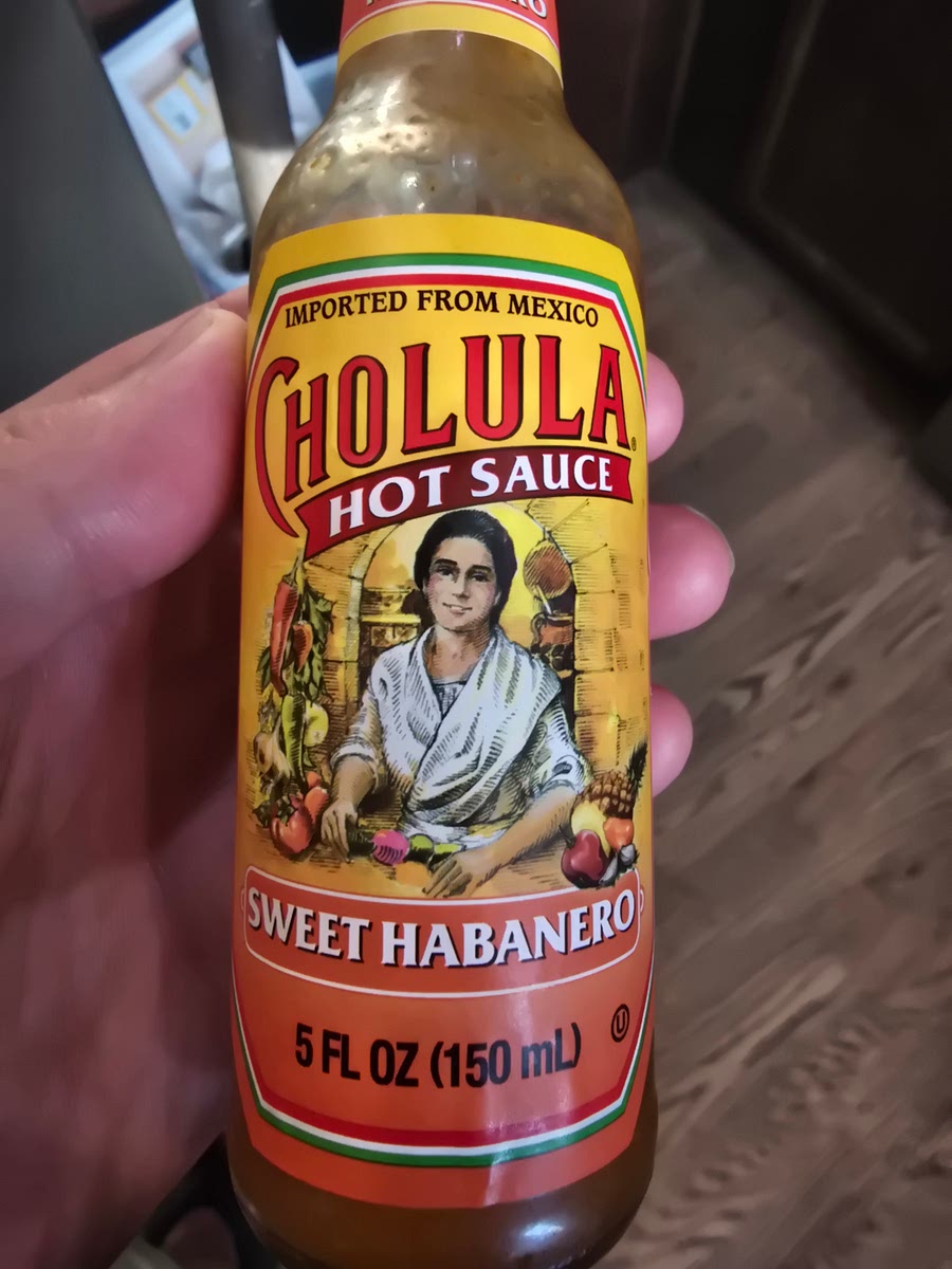 Add garlic, ginger, salt, pepper and cholula, cook till chicken is thoroughly cooked.