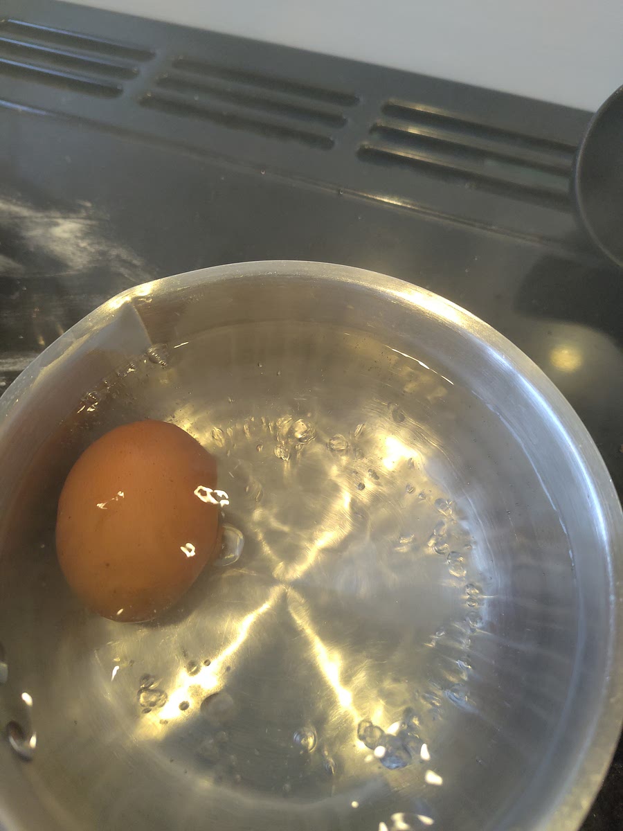 Place eggs in pan of boiling water for 5 mins. Careful not to let them crack.