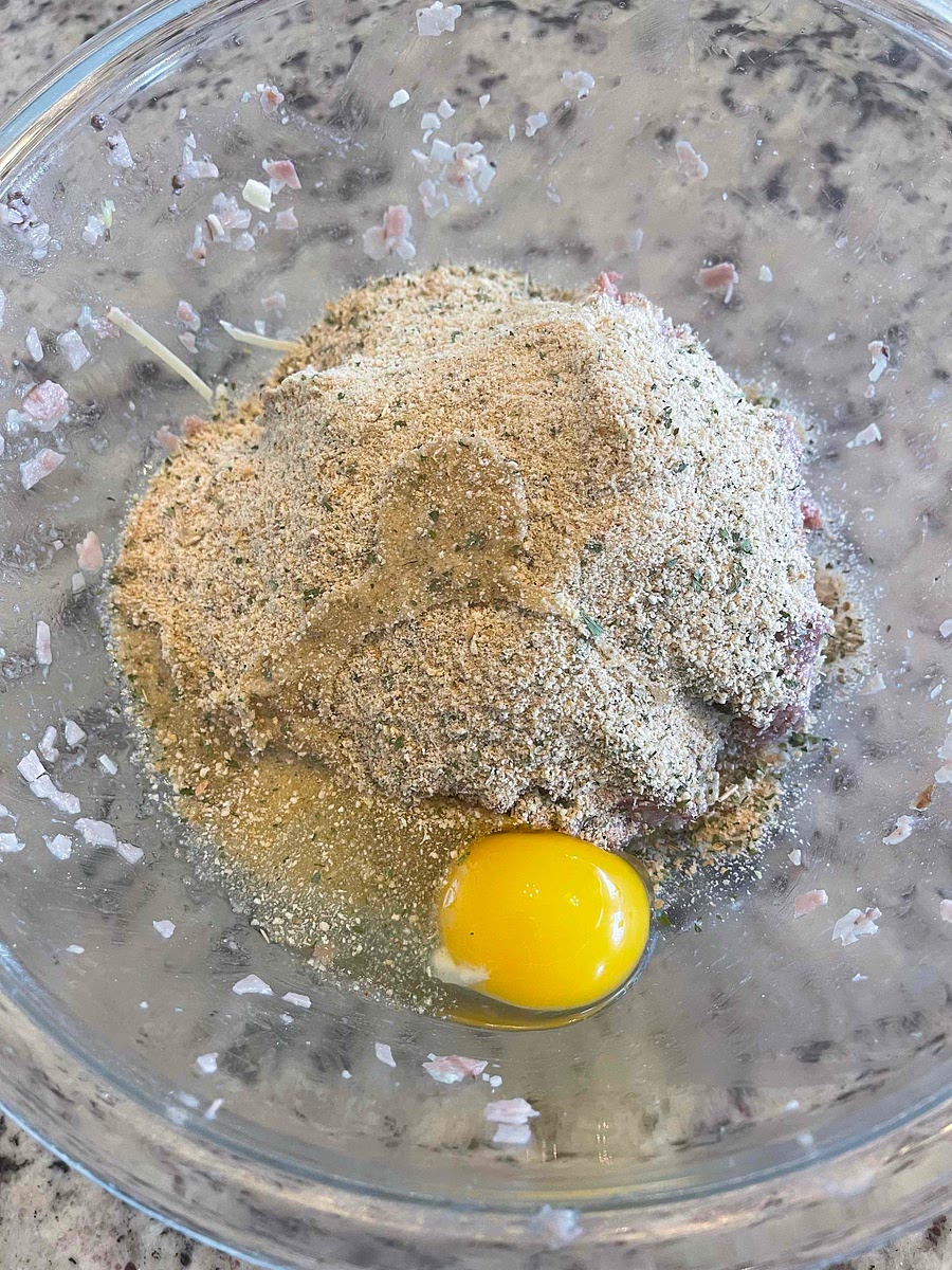 Add the bread crumbs and one whole egg.