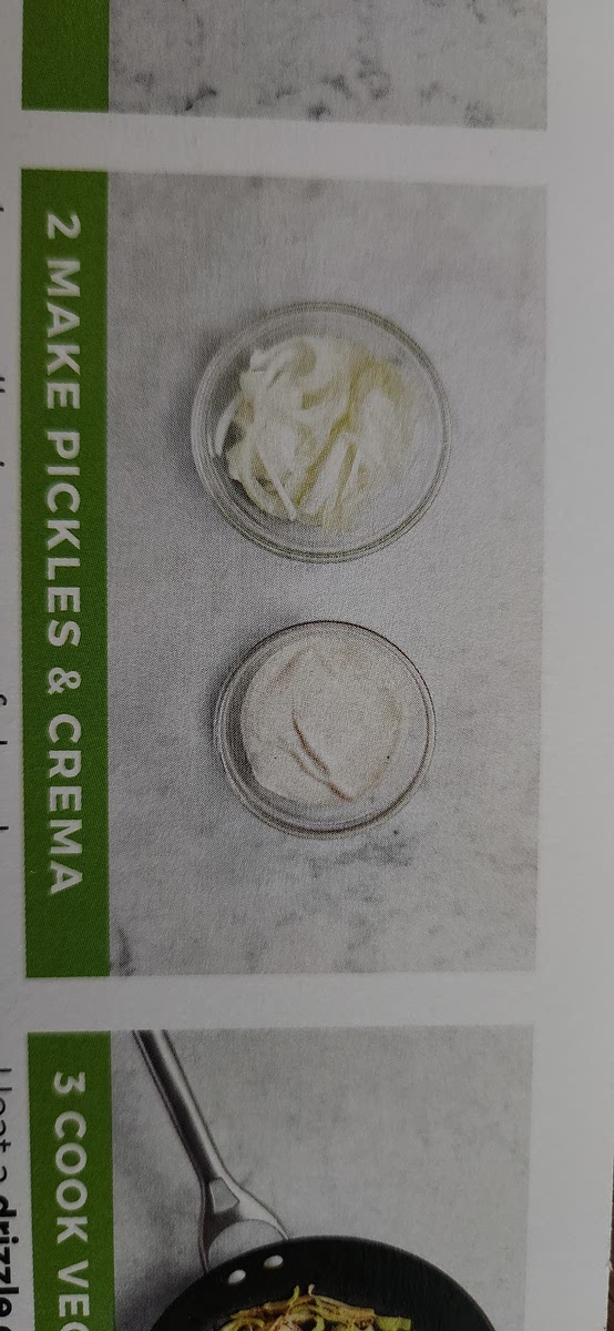 2 MAKE PICKLES & CREMA • In a small, microwave-safe bowl,
combine 1/4 of the onion, juice from
half the lime, 2 tsp sugar, and a pinch of salt. Cover with plastic wrap and microwave for 30 seconds. Set aside. . In a separate small bowl, combine sour
cream with 1/2 tsp Southwest Spice
Blend. Season with salt and pepper. Stir in water 1 tsp at a time until mixture reaches a drizzling consistency.