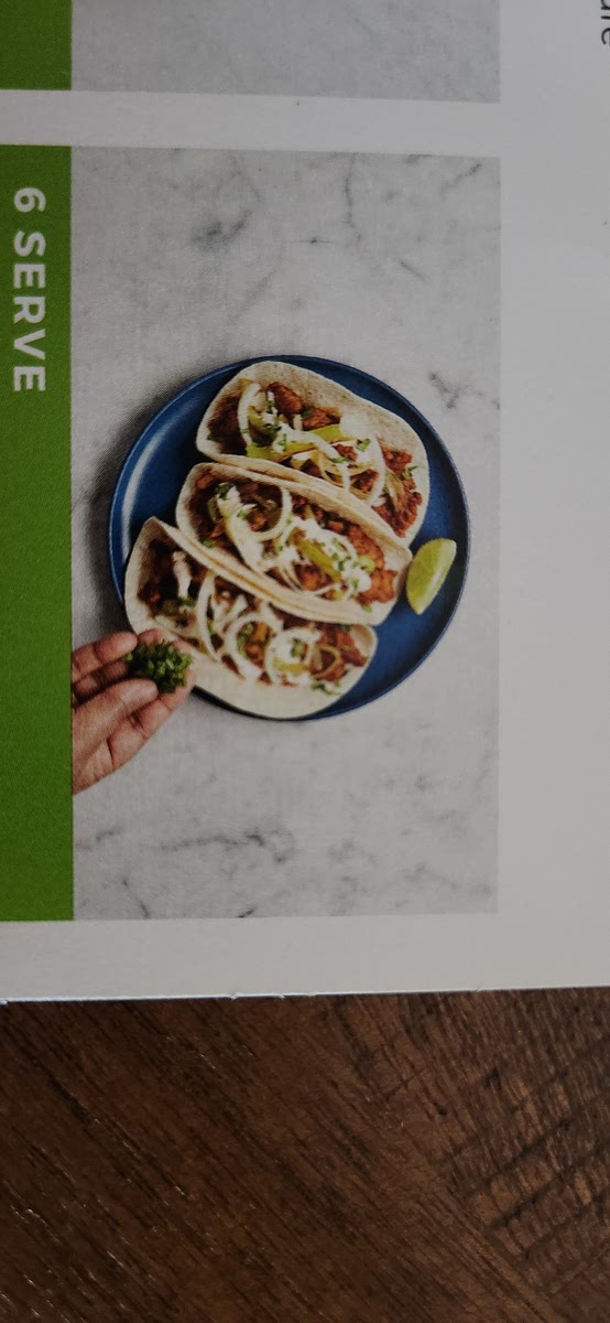 6 SERVE •Divide tortillas between plates and fill
with pork filling and veggies. Drizzle
with crema and top with pickled
onion (draining first) and cilantro.
Serve with any remaining lime
wedges on the side.