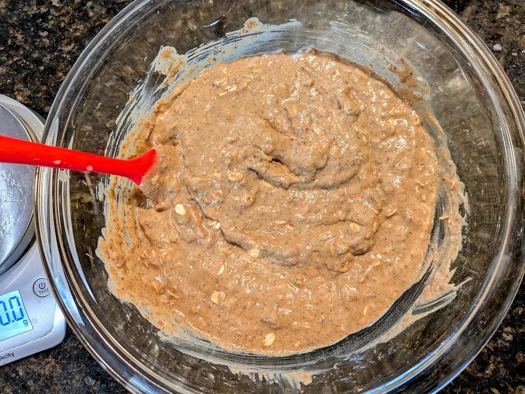 Fold in the rolled oats and raisins with a silicone spatula. The cookie dough should be very loose, almost more like the consistency of a brownie batter