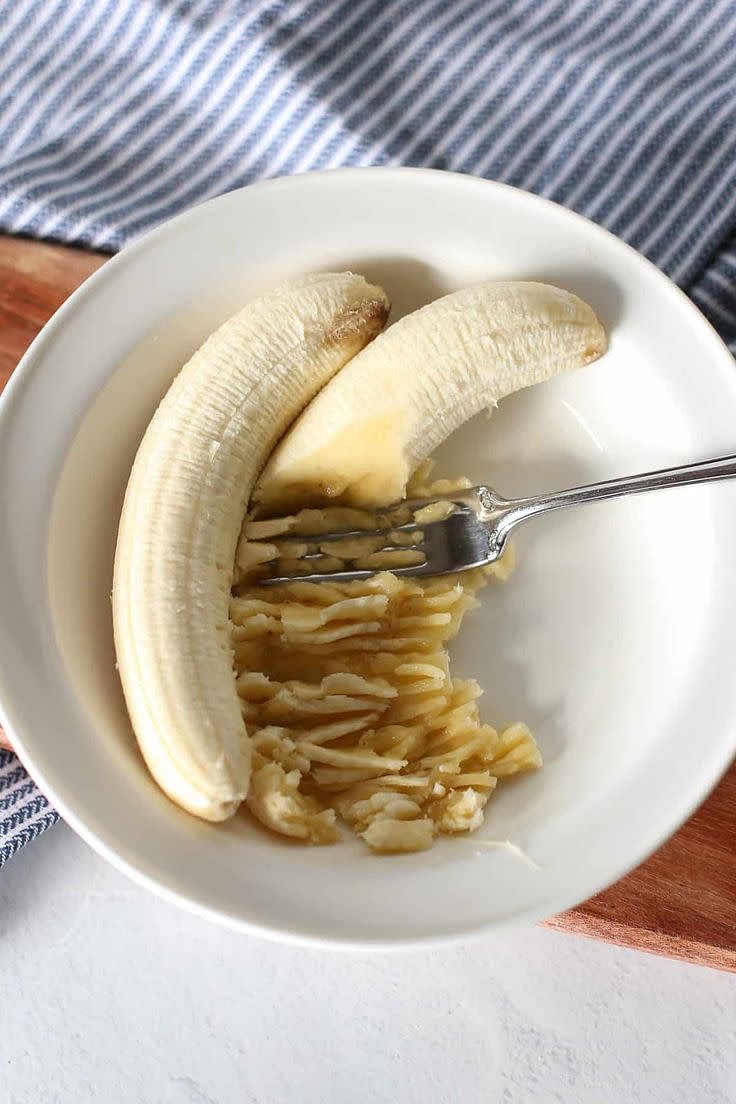 In a bowl, mash bananas until smooth.