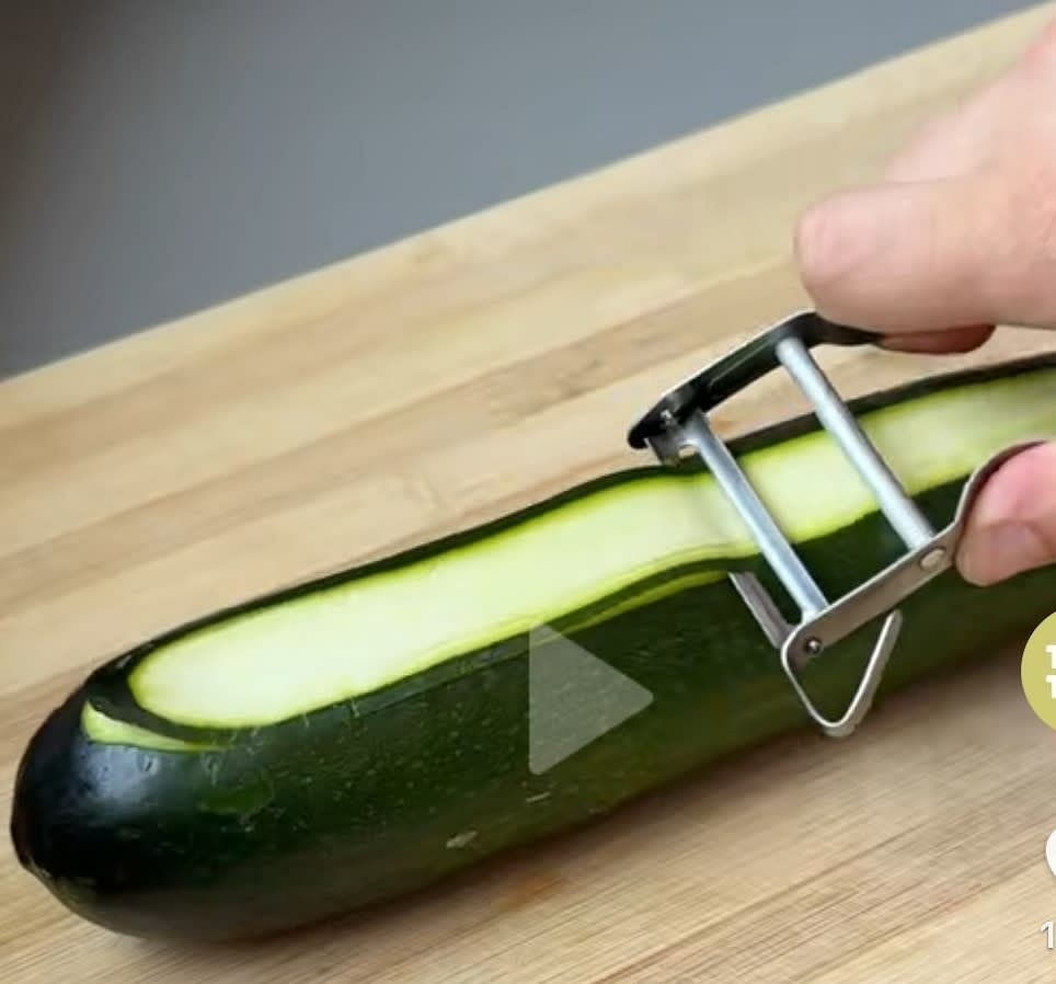 Cut the zucchini into thin strips using a peeler. Then cut the strips in half so their like a noodle.