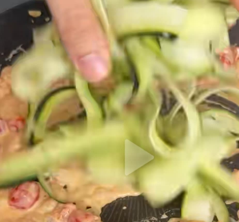 In a saucepan on medium heat combine the garlic, cherry tomatoes, shrimp, cream cheese & zucchini noodles for about 10 minutes.