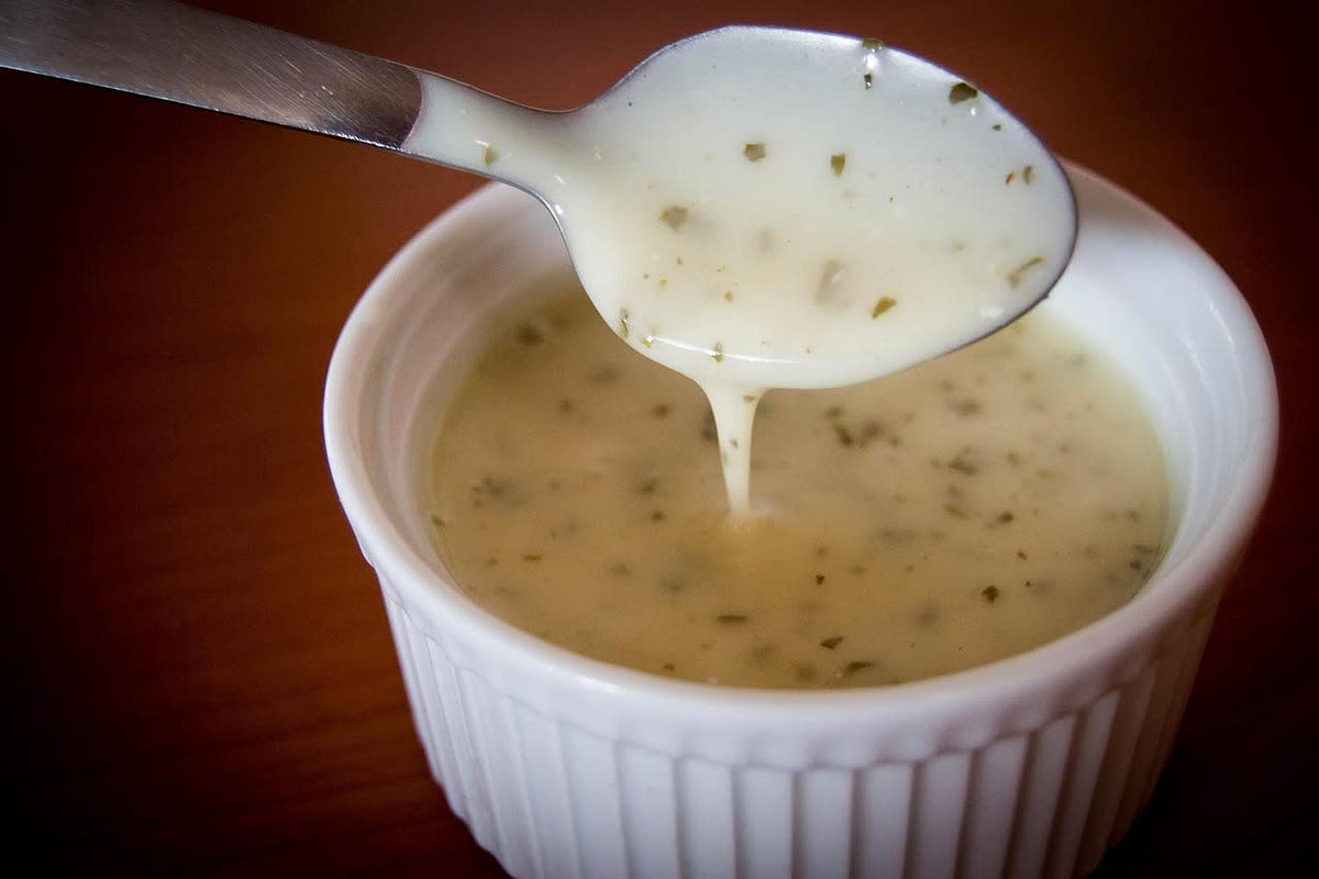 Add the lemon, vinegar, garlic, oregano, and salt and pepper. Whisk until creamy. Taste and adjust flavors. Save in a mason jar in the refrigerator until ready to use.