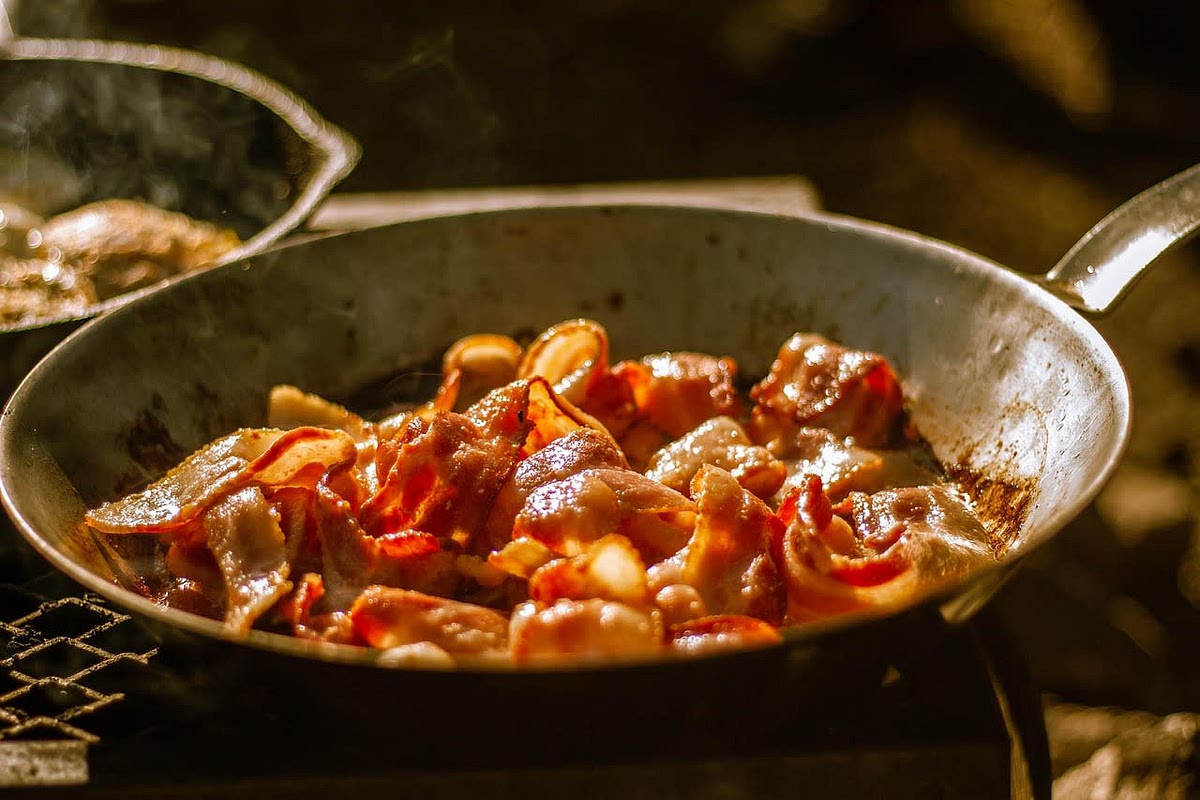 Chop the bacon and cook it in a heated pan until crispy