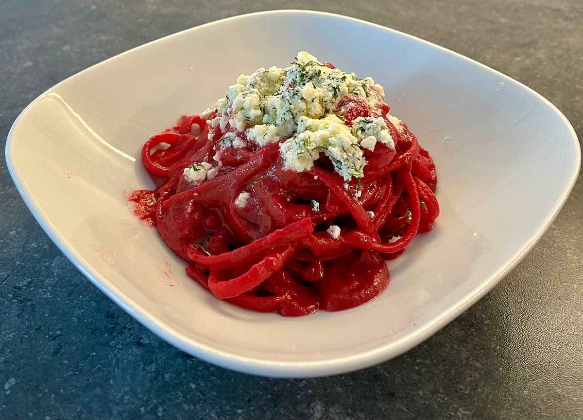 Plate the pasta, top it with the feta mix, drizzle the extra virgin olive oil on top, and serve right away.