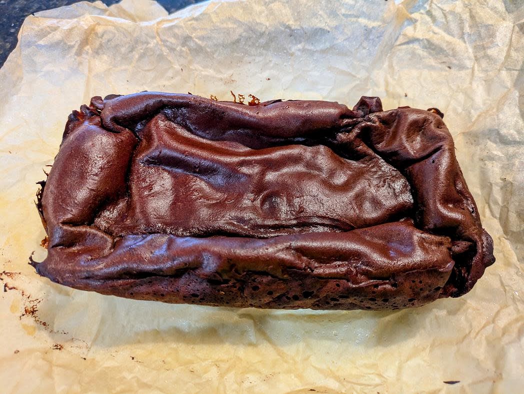 Bake at 350F for about 45 minutes, or until browned and risen. It will be puffed up now, but collapse as it cools; this is normal
