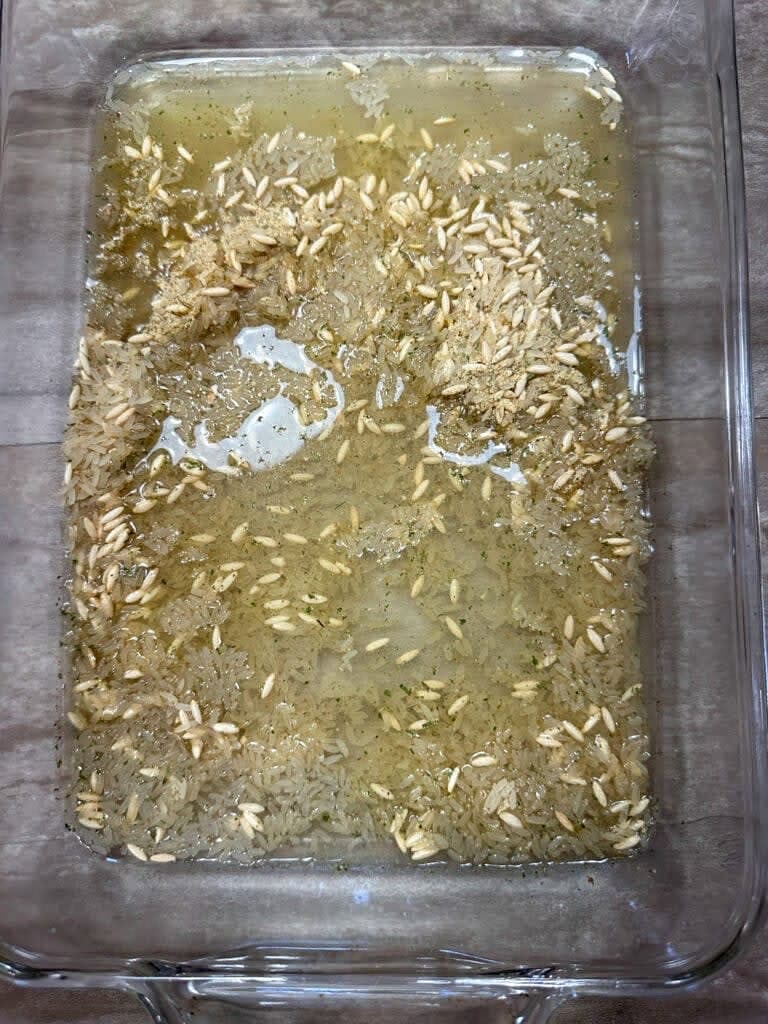 Next, pour the water in with the rice and stir it around to make sure it all gets wet.