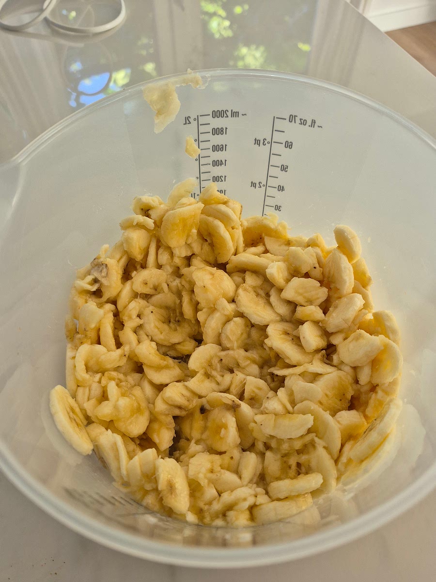 Mash the bananas in a large bowl.