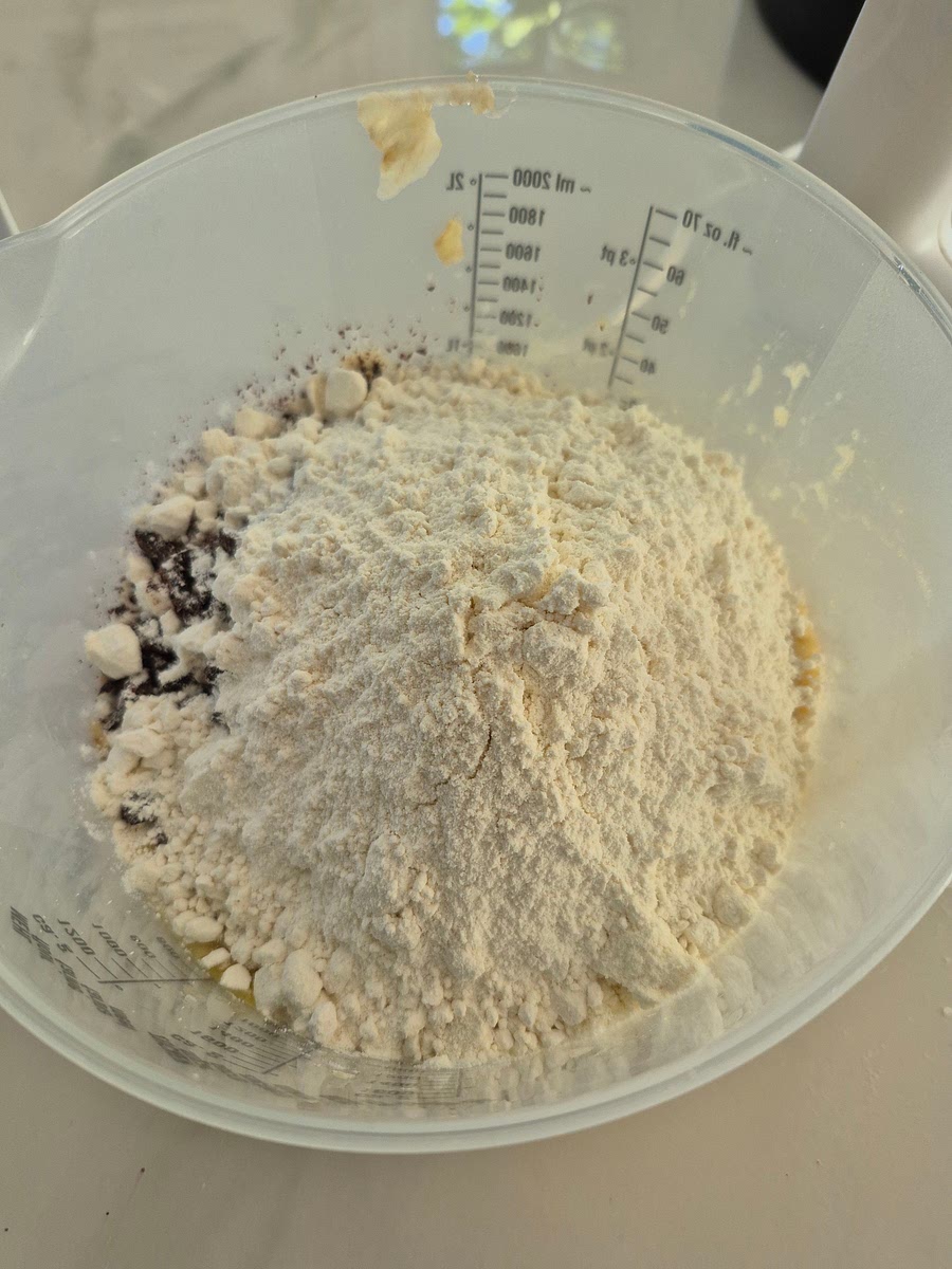 Add the flour, protein powder, chocolate chips, and baking powder. Mix until you have a smooth batter.