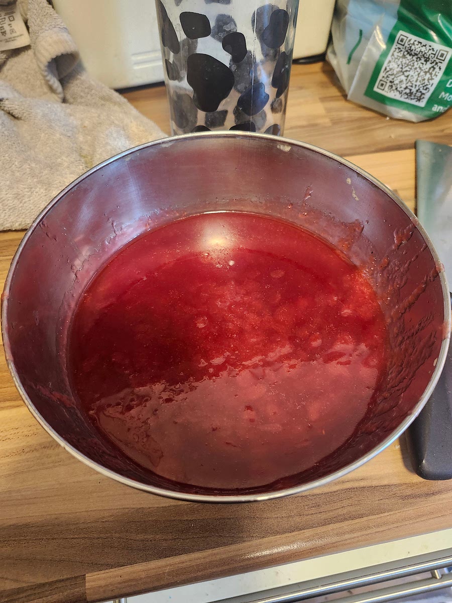 Remove from the heat and cool. Once cool, strain the syrup over a mesh sieve or strainer, and push the fruit down to gather all of the juice.