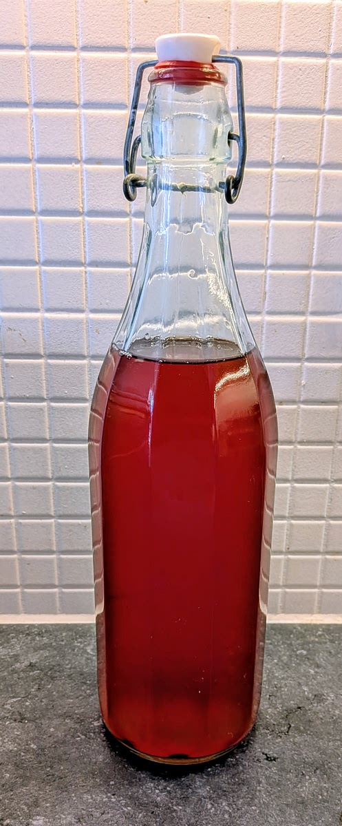 Once cooled, add the syrup to the bottle, put in a stopper, mix and rest it in a dark cool place for at least a week.