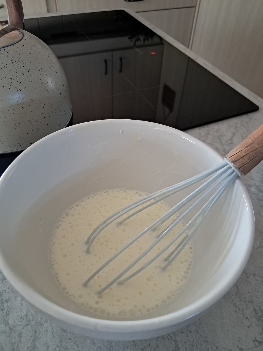 Once the milk reached 110 degrees F, mix the 125ml yogurt starter with a bit of the milk.