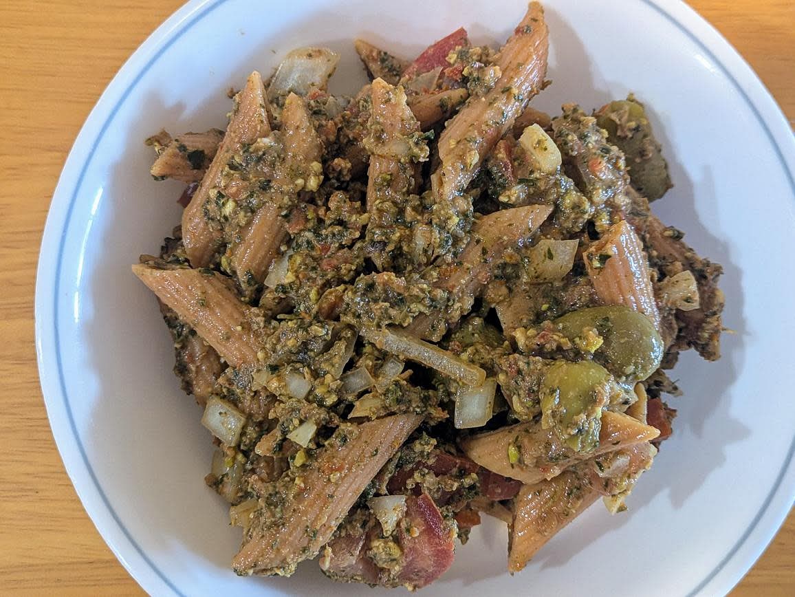 Add the dressing into the pasta bowl, and mix until fully combined. Serve cold or warm