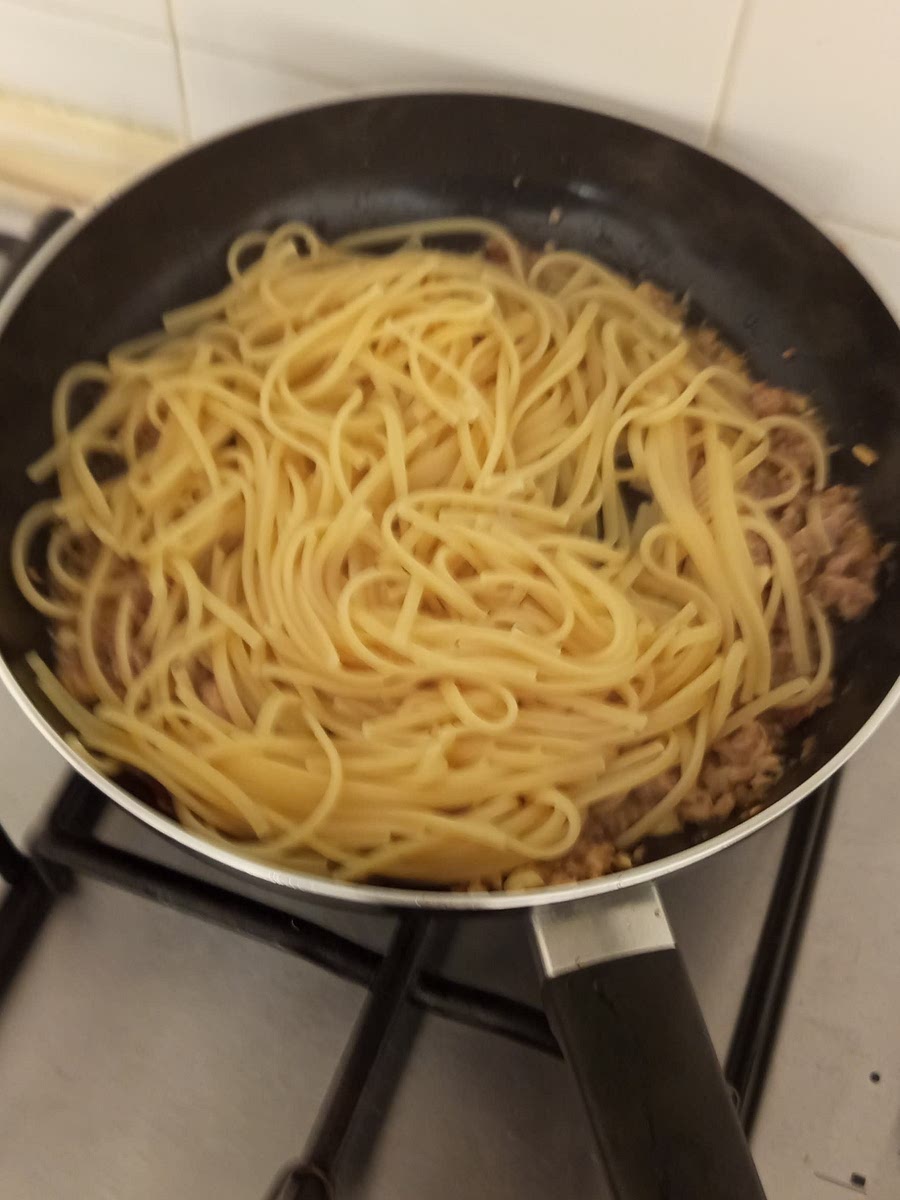 Once the pasta is cooked, drain it and add it to the tuna mixture, stir everything up and let it cook for a couple of minutes on low heat until fully combined