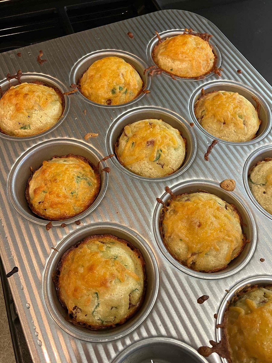 Bake for 20-25min, sprinkle shredded cheese on top of muffins, bake 5 min.