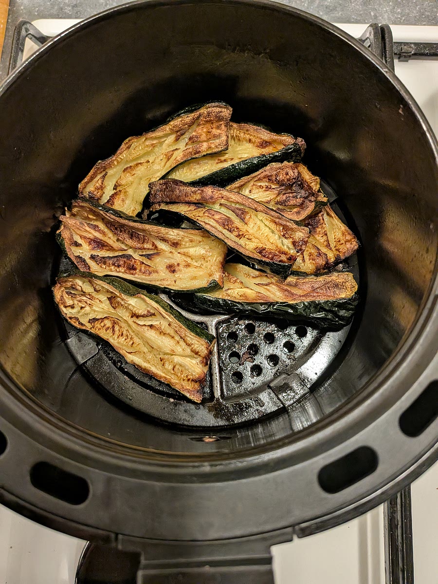 Cut the courgette in half, lengthwise and score them diagonally both ways with a knife. Salt them and drizzle some olive oil on them, and air fry at 180°C until soft and slightly golden (about 20-25 minutes).