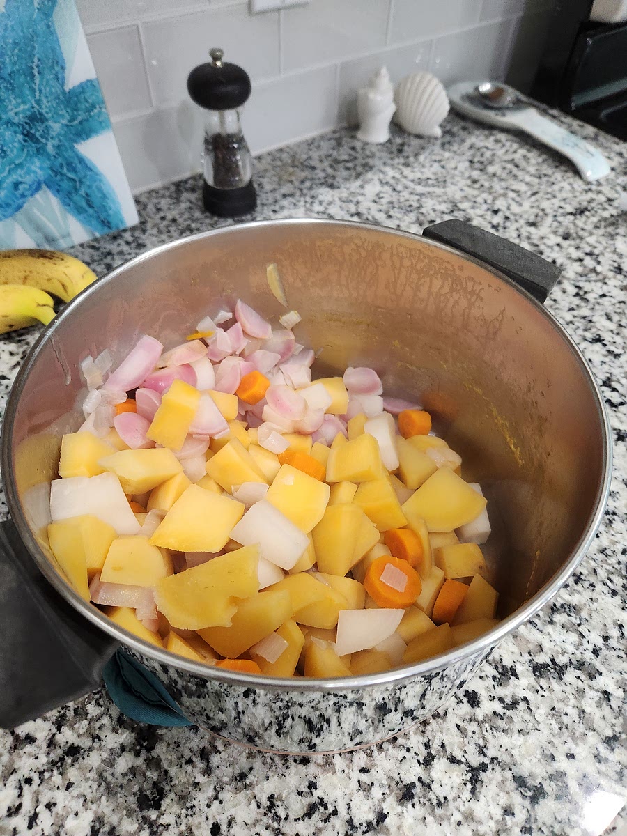 Once all the vegetables are soft, mostly waiting on the rutabaga to soften, drain the water out with a lid over the sink, or use a colander.