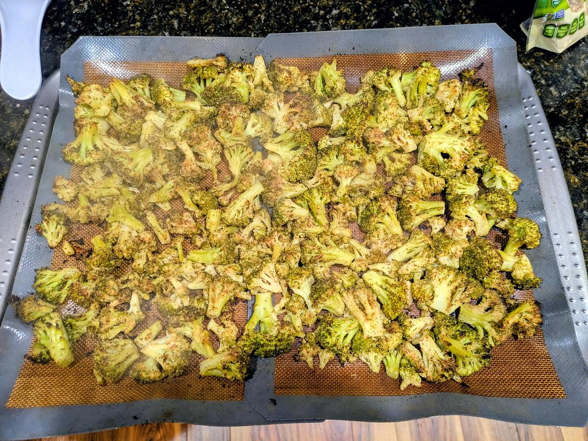 Meanwhile, preheat your oven to 400F, and line a large cookie sheet with parchment paper. Toss the broccoli with lemon juice, oil, lemon pepper, garlic powder, onion powder, and black pepper. Roast at 400F for about 30 minutes, or until browned