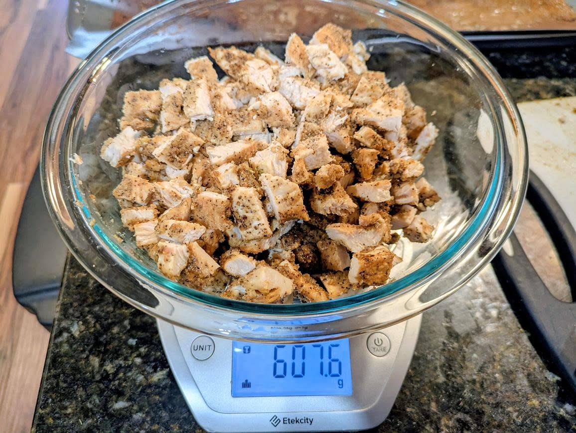 Cut your chicken into thin cutlets, and add to a large bowl. Season with vinegar, oil, garlic powder, onion powder, black pepper, and salt. Add to a parchment lined cookie sheet, and roast at 400F until the internal temperature is 165F (about 14 minutes). Let rest for a few minutes before dicing into bite sides pieces