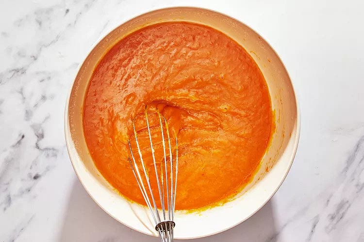 In another bowl, whisk together melted butter, vegetable oil, sugar, eggs, pumpkin, and vanilla until smooth and evenly combined.